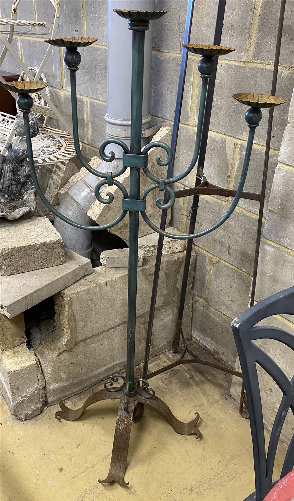 A wrought iron pot stand and large wrought iron five branch floor standing pricket candlestick, candlestick 126cm high